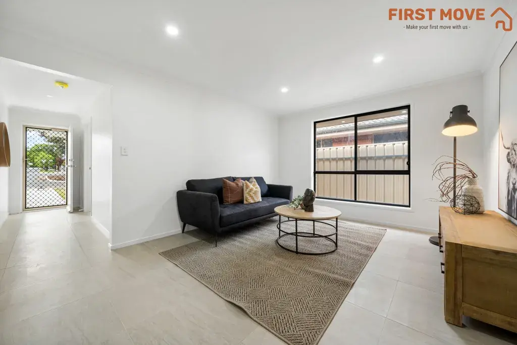 5A Rowe Avenue, Northfield, SA 5085 Modern living room with minimalist decor.